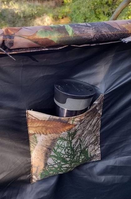 Close-up of tree stand blind storage pocket for hunting gear and accessories