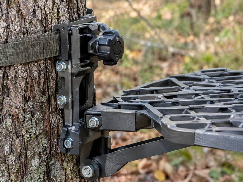 Saddle Hunting Platform Leveling Bracket - Close-up of a saddle hunting platform mounting bracket and adjustment knob